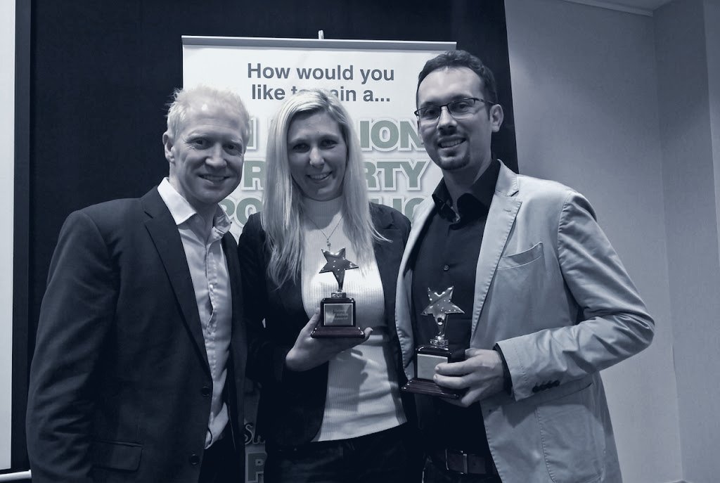 Seb and his business partner receiving property investment awards